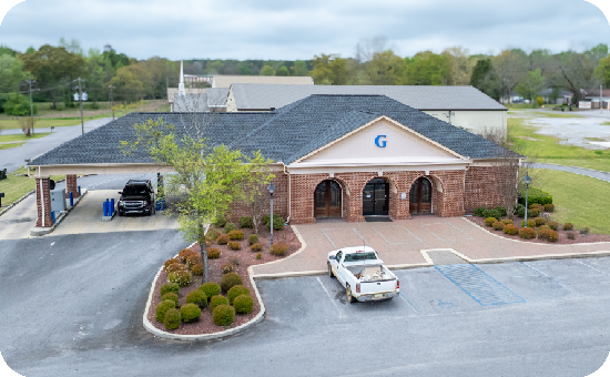 Exterior view of Guardian Credit Union’s Clanton branch building, with visible parking lot.