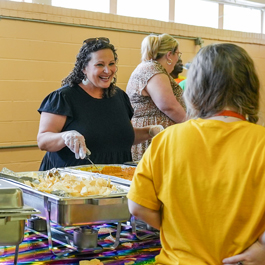 Guardian Credit Union team member helping at a community event.