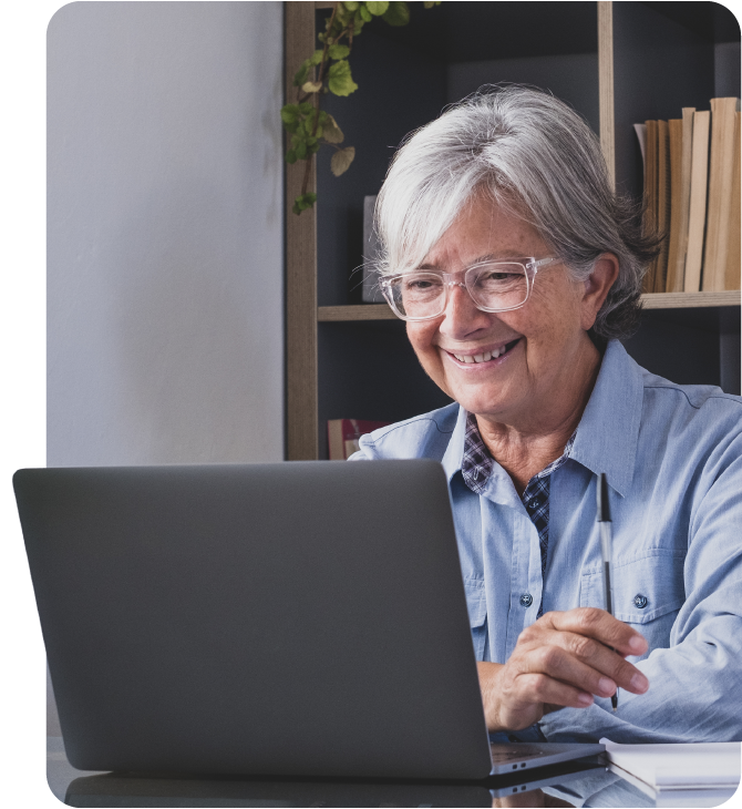 Mature woman feels safe using Guardian CU’s Online Banking from home.