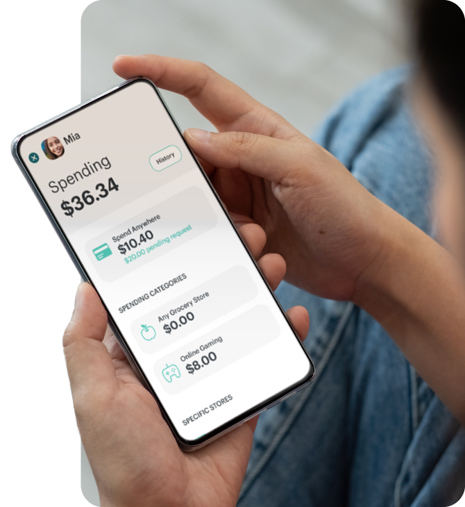 Greenlight app on phone showing child’s Spending summary and budget categories