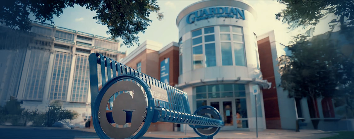 Guardian Credit Union bench outside the 418 Madison Avenue Branch in Montgomery, Alabama — part of the “Behind the Bench” campaign reflecting community, connection, and commitment.