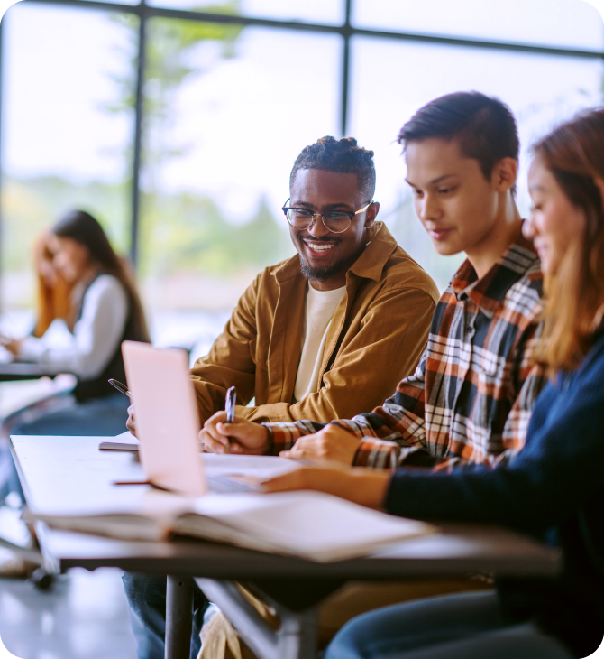 Happy students studying together at school Guardian Scholarship Program