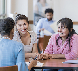 Guardian Credit Union members meeting with a financial representative to discuss credit union services