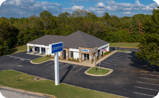 Exterior view of Guardian Credit Union’s Eastdale branch building, with visible parking lot.