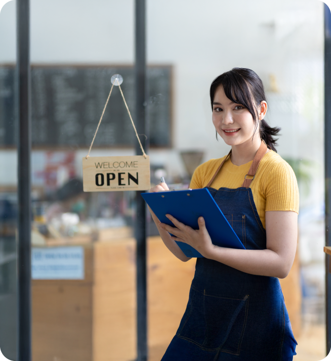 Two women standing confidently in their shop, representing Guardian Credit Union’s business solutions