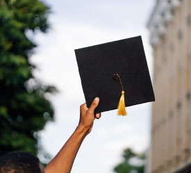 Graduate celebrates success, representing Guardian Credit Union’s commitment to education and smart financial planning