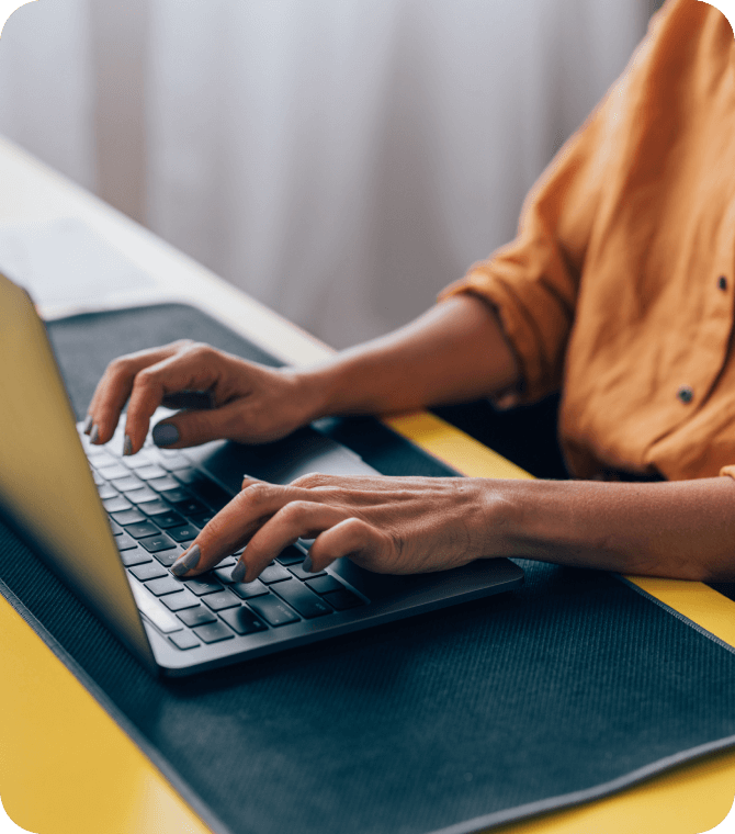 Close-up of person typing on a laptop, highlighting Guardian Credit Union’s secure and easy online services
