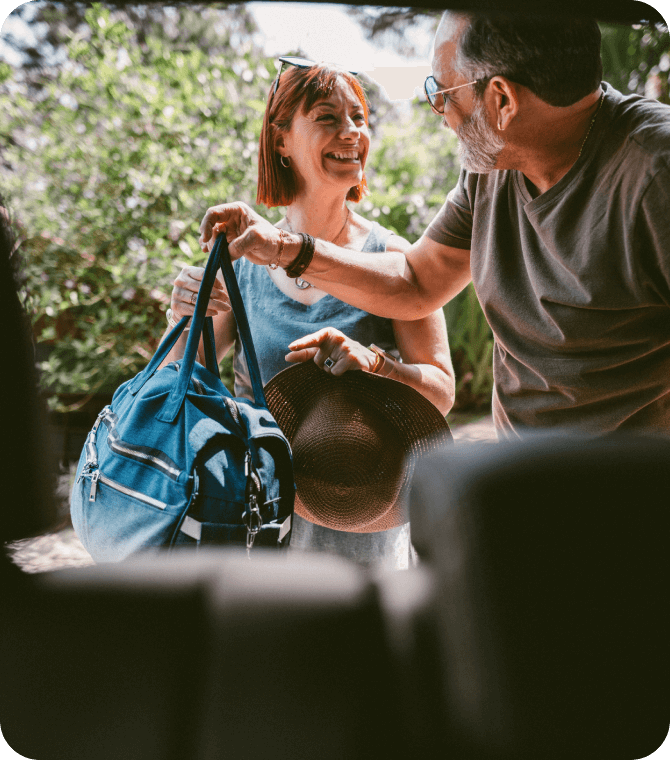 Couple packing for a trip with help from Guardian Credit Union personal and vacation loan services