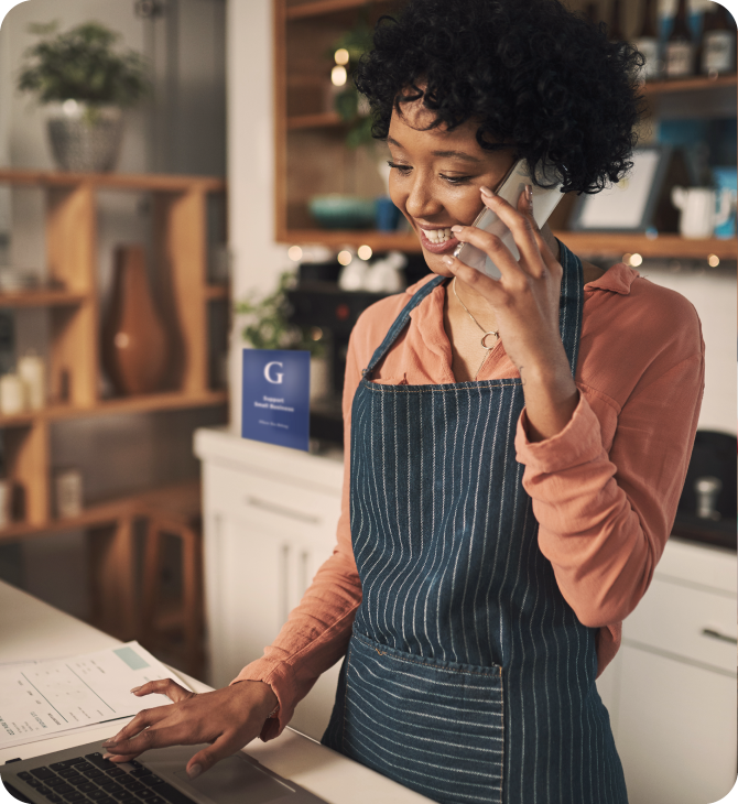 Smiling man using a tablet in a modern office, representing Guardian Credit Union's digital banking services