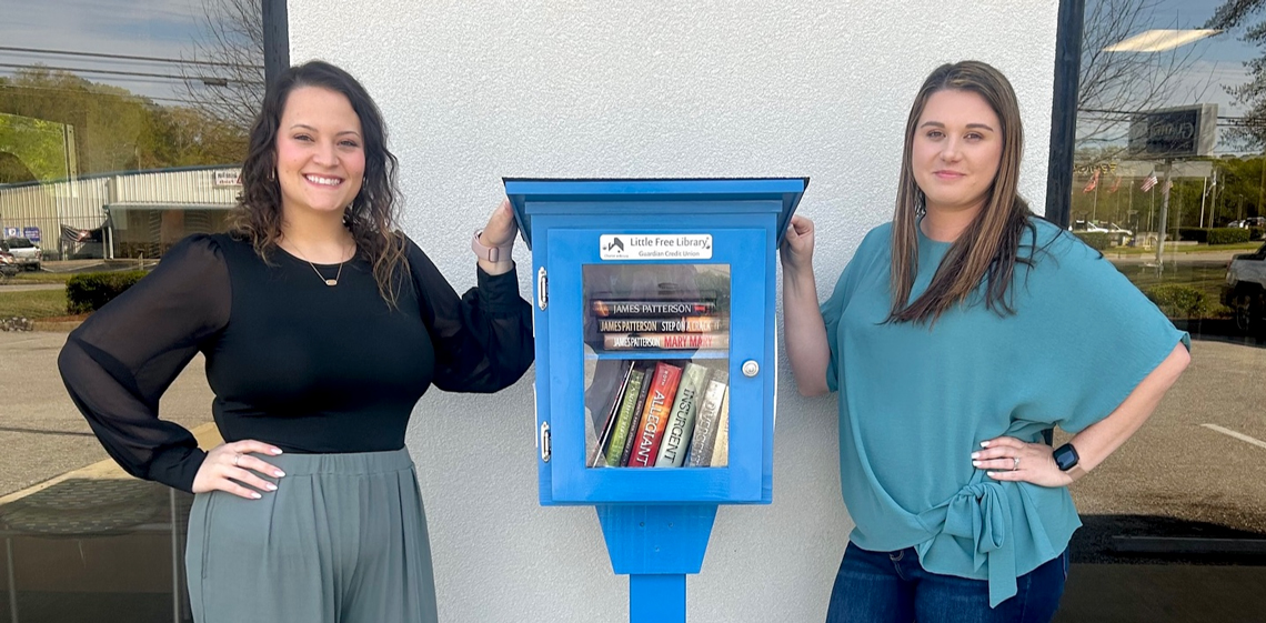 Two Guardian Credit Union team members on the Tallassee's Little Library inauguration