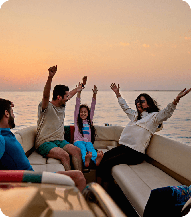 Family enjoying a boat ride financed through Guardian Credit Union recreational vehicle loans