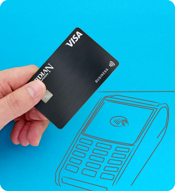 Hand holding a Guardian Credit Union Visa Business card near a contactless payment terminal illustrated on a blue background.